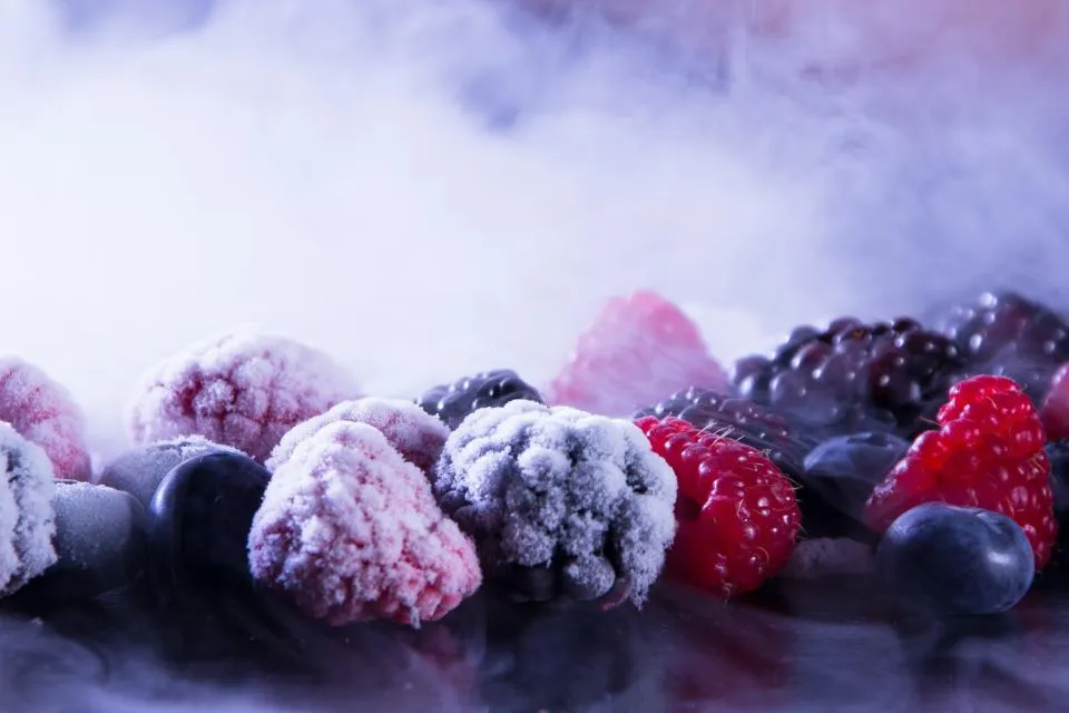Frozen raspberries, blackberries and blueberries covered in frost